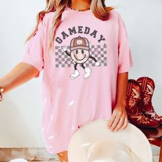 Hey there, baseball-loving fashionistas! Elevate your game day look with our "Game Day Baseball Leopard" Comfort Color Tee, tailored just for you! 🌟⚾ Picture this: It's a sunny afternoon at the ballpark, and you're gearing up to cheer on your favorite team. As you slip into our ultra-soft tee, you feel the cozy fabric hug your skin, providing the perfect blend of comfort and style. It's the ideal choice for a busy mom like you, balancing family fun with a passion for the game. But what makes th Sporty Baseball Jersey With Graphic Print For Game Day, Sports Fan Cotton Baseball Jersey For Game Day, Cotton Baseball Jersey For Game Day, Sporty Graphic Print Baseball Jersey For Game Day, Baseball Jersey With Graphic Print For Game Day, Casual Baseball Jersey For Sports Season, Casual Tops For Baseball Season Fan Gear, Casual Short Sleeve Baseball Jersey For Spring, Game Day Baseball Jersey With Graphic Print