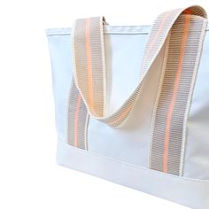 Product Details: This Cabana tote is the ultimate beach bag sun-seeker. With its spacious interior, this tote is perfect for carrying all your beach or pool essentials, from towels and sunscreen to snacks and drinks. This bag is durable and made of a waterproof fabrication. We think this bag changes the beach game. It is so chic, yet so useful. Dimensions 12.5”H x 21.5” W x 8”D Handle Drop 11" Made from 18.5oz tear and water-proof vinyl-coated nylon. Pool Essentials, Beach Games, Mini Moderns, Wine Tote, Hats For Sale, Beach Pool, Water Proof, Tennis Court, Clutch Purse