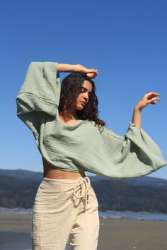 Embrace effortless style with this 100% natural cotton flowy long sleeve crop top, perfect for a beach day or a casual outing. The ultra-soft texture feels like a gentle breeze against your skin, while the breathable fabric keeps you cool under the sun. Its relaxed, flowy fit adds a laid-back charm, making it the ideal companion for your beach look. With its lightweight, natural feel, this top is both durable and chic, perfect for layering over your swimsuit or pairing with your favorite beachwe Ward Robes, Boho Crop Tops, Environmental Damage, Conscious Fashion, Organic Cotton Fabric, Long Sleeve Crop, Eco Conscious, Physical Health, Soft Texture