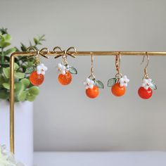 🍊Material: handmade with Czech glass oranges, glass flowers, acrylic leaves and 14K gold plated/ 925 sterling silver plated ear hooks which is hypoallergenic. 🌺Size: the hook style is about 0.6" wide and 1.35" long; the stud style is about 0.6" wide and 1" long Orange Dangle Resin Earrings, Orange Resin Dangle Earrings, Orange Drop Earrings For Gift, Orange Dangle Flower Earrings With Ear Wire, Orange Dangle Flower Earrings Gift, Orange Dangle Flower Earrings For Gift, Earrings Food, Fruit Orange, Flower Acrylic