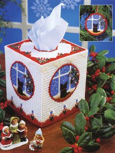 an ornament box with tissue paper on it and decorations around the window sill