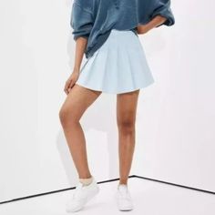 It’s Made From A Soft, Stretch Twill Fabric That Gives It A Structured Look. The Skirt Features Pleats All Over, A Super High Rise, And An Exposed Back Zipper. It Also Has Side Pockets. Casual High Waist Tennis Skirt With Elastic Band, Casual Blue Tennis Skirt With Elastic Waistband, Light Blue Stretch Mini Skirt, Cotton Mini Hem Lined Skirt, High Waist Light Blue Skirt, Casual High Waist Tennis Skirt For Spring, Blue Relaxed Pleated Skirt With Elastic Waistband, Casual Blue Denim Skirt With Elastic Waistband, Blue Pleated Skirt With Elastic Waistband