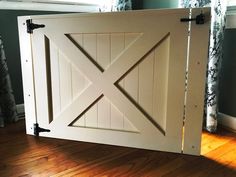 a white barn door with black hardware on the bottom and side panels that are closed