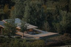 an aerial view of a house in the woods