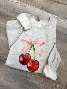 Elevate your aesthetic with our Coquette Cherry and Bow Sweatshirt, a charming blend of cottagecore vibes and trendy design. This ribbon crewneck is the ultimate coquette clothing piece, offering a unique and stylish addition to your wardrobe that captures the essence of modern romance and nostalgia. Ash Grey Color Sweatshirt! :) All made by me! FREE SHIPPING on orders over $35 Gildan: UNISEX * 50% cotton, 50% polyester * Pre-shrunk * Classic fit * Air-jet spun yarn with a soft feel and reduced pilling * Double-needle stitched collar, shoulders, armholes, cuffs, and hem Care Instructions: * Turn inside out * Machine Wash Cold * DO NOT IRON * Do not bleach * Hang dry- or tumble dry on low heat as possible :) 10% of profits are donated to nonprofit organization. REFUNDS AND EXCHANGES All ite Cottagecore Cotton Crew Neck Sweatshirt, Cotton Cottagecore Sweatshirt With Long Sleeves, Cottagecore Long Sleeve Cotton Sweatshirt, Spring Cotton Sweatshirt Gift, Coquette Gifts, Coquette Cherry, Bow Sweatshirt, Coquette Clothing, Coquette Top