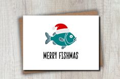 a christmas card with a fish wearing a santa hat