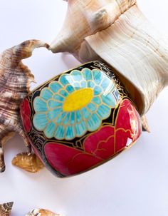 Vintage bracelet in multicolour. Flora motif throughout. * Stamp La Route de la Soie at the inner band- the Silk Road (English) * Glod-tone hardware The Silk Road, Vintage Bracelet, Silk Road, Bracelet Vintage, Vintage Bracelets, Bangle Bracelets, Jewelry Bracelets, Etsy Accessories, Bangles