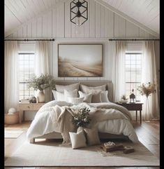 a bedroom with white bedding and pillows on the floor next to a painting hanging above it