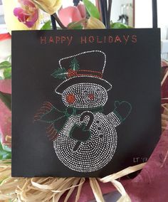 a happy holidays card with a snowman on it and some flowers in the background