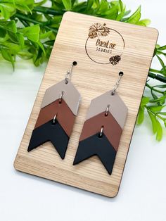 Neutral Black Brown Ombré Genuine Leather Chevron Dangle Earrings Beautiful, lightweight, chevron dangle earrings made of smooth, genuine leather in a neutral ombré color pallet. Trendy, boho, and unique, these earrings are sure to make a statement with any outfit! Each pair is made to order and due to the nature of genuine leather, small, natural imperfections may be present and are normal. Earring wires are made of surgical stainless steel, making them hypoallergenic and great for sensitive ears.  Earring Features: * Genuine leather * Surgical stainless steel ear wires with clear backs * Measures approximately 2 inches in length * Lightweight *Please Note: I try my best to capture the most accurate colors of materials. However, colors may appear different on computer/phone screens Our ea Chevron Earrings, Earring Wires, Phone Screens, Brown Ombre, Trendy Boho, Navy And Brown, Ombre Color, Color Pallets, Sensitive Ears