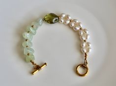 Beautiful jade and freshwater pearl beaded bracelet with toggle closure, good for both daily life and formal occasions. Looks expensive.  Usually ships within 1-2 business days,.  Thanks for purchasing. Elegant Jade Beaded Bracelets For Gift, Elegant Green Pearl Bracelet With Natural Stones, Elegant Jade Pearl Bracelet For Gift, Elegant Jade Bracelets For Wedding, Pearl Bracelet With Natural Stones For Wedding, Elegant Jade Gemstone Beaded Bracelets, Elegant Pearl Bracelet With Gemstone Beads, Elegant Green Jade Pearl Bracelet, Elegant Green Jade Bracelet