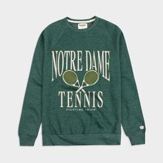 a green sweatshirt with tennis rackets printed on the front and back, in white lettering