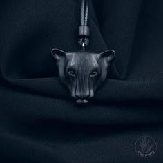 The panther design embodies strength, grace, and confidence. Panthers have always been a symbol of elegance and masculinity, and now you can wear it in the form of this exquisite pendant. It will accentuate your individuality and add a touch of mystery to any outfit    [CARE] The pendant is sealed with two or more layers of wood oil in order to protect the wood against moisture and the environment. The oil makes the pendant moisture resistant, but not waterproof. We recommend for this product to Black Carved Symbolic Necklace, Panther Necklace, Jaguar Necklace, Wooden Wolf Pendant, Nature-inspired Wooden Pendant Jewelry, Wood Oil, Wooden Necklace, Wood Necklace, Wood Pendant