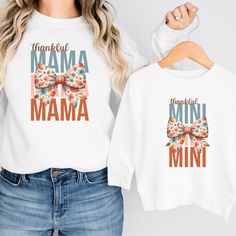 These adorable matching mommy and me sweatshirts are perfect for Fall! Available in multiple sizes and shirt styles to fit toddlers, babies, and of course mom! The sweatshirts, t-shirts, and baby bodysuits are all made of soft, high-quality fabric to keep everyone comfy and cozy this fall! How to Order Your Matching Shirts: 1) Select the first size (for either Mom or Child) from the dropdown menu. Click "Add to Cart". 2) Go back to the listing, select the second size (for the second person), and click "Add to Cart" again. 3) Repeat for as many sizes as you would like.  4) Once all the desired sizes are added to your cart, proceed to checkout! SHIRT INFORMATION & SIZING: The crewneck sweatshirt and hoodie options are Gildan Heavy Blend sweatshirts made from a blend of 50% cotton and 50% pol Family Matching Long Sleeve Tops With Custom Print, White Long Sleeve Matching T-shirt, Cute Name Print Tops For Fall, Cute Tops With Name Print For Fall, Long Sleeve Tops With Name Print For Family, Family Matching Sweatshirt For Fall, Family Matching Long Sleeve Custom Print T-shirt, Family Letter Print Tops For Fall, Family Matching Fall Sweatshirt