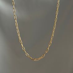 "This dainty piece is the perfect everyday staple. No matter the occasion, be sure to feel gorgeous in such a high quality necklace, made for you.   MATERIALS & COMPONENTS * Made with 304 Gold Plated Stainless Steel Paperclip chain - 5x2.5x0.5mm * Water & Tarnish resistant * Skin friendly * Your choice of 16\", 18\", 20\" & 22\"   JEWELLERY CARE  Although Stainless Steel jewellery is water and tarnish resistant, I'm sure you want your jewellery to last as long as possible  * Avoid swimming in the sea & swimming pools  * Avoid wearing your jewellery when showering and exercising * Put on perfumes and lotions before putting on your jewellery  * If your pieces get wet, pat it dry immediately. SHIPPING & RETURNS  We offer FREE delivery on UK orders via 2nd Class Royal Mail.  We offer a 14 day Minimalist Paperclip Chain Necklace As Gift, Minimalist Paperclip Chain Necklace For Gift, Minimalist Paperclip Chain Necklace Gift, Simple Paperclip Chain Necklace As Gift, Simple Paperclip Chain Necklace Gift, Minimalist Paperclip Necklace As Gift, Minimalist Paperclip Necklace For Gift, Gift Clavicle Chain Necklace With Paperclip Shape, Delicate Gift Chain Necklace With Paperclip Chain