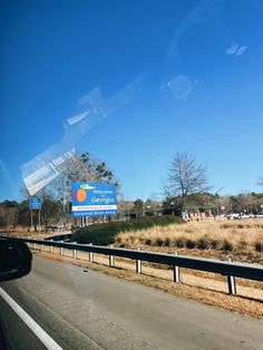 a highway with a large sign on the side of it