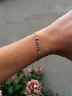 "Simple and dainty lapis lazuli bar chain bracelet Made from PVD gold plated stainless steel and jewelry wire so you can wear it every day without worries about the gold tone - the metal is sweatproof and waterproof Adjustable lenght 16 - 21 cm = 6.3\" - 8.3\" Looks nice also in stack, take a look at our herringbone chain bracelet here https://cutt.ly/5wfS19ZW Lapis lazuli is gem which is considered the alternative birthstone for the month of September You will recieve your jewelry nicely packed Minimalist Adjustable Lapis Lazuli Jewelry, Adjustable Minimalist Lapis Lazuli Jewelry, Gold Lapis Lazuli Bracelets For Gift, Minimalist Blue Bracelet With Delicate Chain, Dainty Lapis Lazuli Jewelry For Gift, Dainty Lapis Lazuli Jewelry Gift, Minimalist Blue Bracelet With Adjustable Chain, Minimalist Lapis Lazuli Jewelry For Gift, Minimalist Lapis Lazuli Jewelry Gift