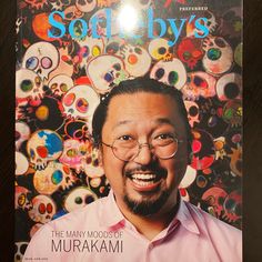 a man wearing glasses is on the cover of soapy's magazine with skulls in the background