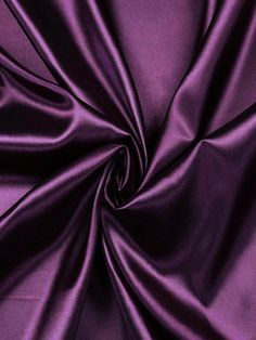 This luxurious satin fabric is perfect for your special occasion designs. Available by the yard, this 58/60 inch wide satin comes in an array of vibrant colors sure to dazzle. The medium weight brings an elegant drape and flow to any garment while maintaining a smooth, lustrous finish. Ideal for wedding and formal gowns, this satin is also suitable for accessories like sashes, headpieces and more. Sew with care as the shiny satin surface can show flaws. Pre-washing is not recommended as it may damage the silky texture. Allow extra fabric for hemming and seam allowances. Enjoy crafting stunning looks with this high quality satin fabric. Luxurious Fabric: This 60" wide satin fabric is lightweight, silky and shiny, perfect for elegant garments or home decor projects. Versatile Material: Mediu Satin Fabric Swatch, Elegant Drapes, Purple Satin, Extra Fabric, Fabric Swatches, Formal Gowns, Luxury Fabrics, Satin Fabric, Fabric By The Yard