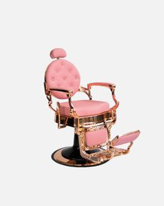 a pink chair with gold trimmings on the back and foot rests in front of a white background