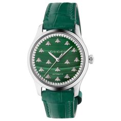 From Gucci, the G-Timeless collection continues to explore emblematic House codes in new ways each season. This automatic watch is designed with a green malachite stone dial, paired with a green alligator leather strap. The emblematic bee motif enriches the style. 38mm steel case Green malachite stone dial with bees Green leather strap Sapphire glass with antireflective coating 5 ATM (164 feet/50 meters) Power reserve: 38 hours Automatic movement Wrist size from 150mm to 190mm Gucci Style #: YA1 Timeless Watches, European Jewelry, Gucci Style, Gucci Watch, Leather Strap Watch, Green Malachite, Malachite Stone, Gucci Fashion, Watch Model