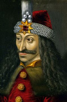 an image of a man with long hair wearing a red outfit and a gold crown