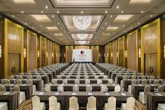 a large conference room with tables and chairs