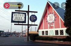 a red and blue building with a sign for the dairy bros