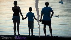 three people holding hands while standing next to the water