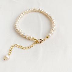 "Natural freshwater pearl bracelet, dainty adjustable bracelet is finished off with paperclip 14k gold fill extender chain and lobster clasp. A elegant gift for her. DETAILS * Genuine Freshwater Pearls * June Birthstone * 4mm Freshwater Pearl beads * Bracelet measures approx. 6.5inch (16.5 cm) in length. * 14k gold fill extender chain and gold filled clasp * Chain and findings are nickel free BRACELET SIZE * Available sizes - 6.5 inches, plus 1 inch paperclip extender chain HOW TO SIZE BRACELET Minimalist Boho Wedding, 30th Anniversary Gifts, Bracelet Dainty, Freshwater Pearl Bracelet, Handmade Wire Jewelry, Free Bracelet, Handmade Jewelry Diy, June Birthstone, Handmade Wire