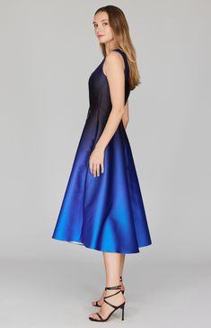 Our signature fit & flare silhouette comes to life with a thoughtfully placed original print. This sleeveless dress features a simple back zip, an elegant tea length hem, and pockets. An elegant choice for your next special occasion. Sleeveless Fit And Flare Gala Midi Dress, Blue Fit And Flare Midi Dress For Evening, Blue Midi Dress For Evening With Flattering Silhouette, Blue A-line Fit And Flare Midi Dress, Blue A-line Midi Dress With Flattering Silhouette, Fit And Flare Midi Dress With Back Zipper, Tea Length, Fit And Flare Dress, Original Prints