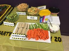 a table topped with lots of food and desserts on top of it's sides