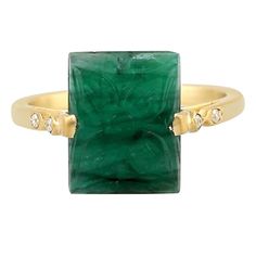 This ring is cast in 18-karat gold. It is hand set with 4.0 carats carved emerald and .03 carats of sparkling diamonds. FOLLOW MEGHNA JEWELS storefront to view the latest collection & exclusive pieces. Meghna Jewels is proudly rated as a Top Seller on 1stDibs with 5 star customer reviews. All items manufactured by us are handmade and can be customized or redesigned. Composition Size-US-7 Total Weight-3.55 Gold Weight(Gms)-2.744 Diamond Wt(Cts)-0.03 Emerald Wt(Cts)-4.0 Carved Emerald, Emerald Diamond Ring, Gold Cocktail Ring, Gold Cocktail, Modern Ring, Emerald Gemstone, Gold Diamond Rings, Emerald Diamond, Sparkle Diamonds