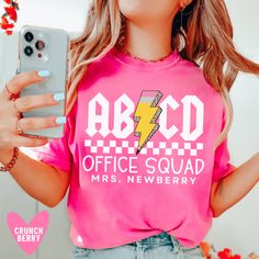 This custom office squad shirt is retro, trendy, and fun! The perfect teacher gift:) Our Bella+Canvas tees have that light and vintage feel. ♥ Our Comfort Colors tees are garment-dyed for that trendy distressed look. ♥ 》 》HOW TO ORDER 《 《 * Select product, size + color from the drop down menus * Add to cart + place order ♥ * Your shirt is now in production & will be ready to ship in 1-3 days! 》 》SIZING 《 《 These tees are unisex, men's cut tops. The Bella Canvas tees run longer than normal and slightly small - so I would NOT downsize. The Comfort Colors tees and long sleeves are boxy cut and true to size. 》 》PRODUCTION + SHIPPING《 《 * Order Production: 1-3 business days  * Standard Shipping: 2-5 business days after production time 》 》 ANATOMY OF OUR SHIRTS 《 《 * Bella Canvas 3001 * Airlume Cheap Screen Print Shirt For School, School Staff Shirt Ideas, Trendy Screen Print T-shirt For Teacher Appreciation, Retro Crew Neck T-shirt For Teacher Appreciation, Retro Short Sleeve T-shirt For Back To School, Retro Crew Neck T-shirt For Back To School, Retro School T-shirt With Text Print, Retro Text Print T-shirt For School, Retro Letter Print T-shirt For School