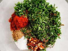 spices and herbs are mixed together in a bowl