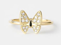 This is a beautiful made to order diamond butterfly ring. This ring comes with genuine brilliant cut diamond. We offer this ring in 10k or 14k, in white, yellow or rose gold. Amazing gift for women or young girls.  D E T A I L S:  * Made in Canada * Made to order * Gold Karat Options: 10k, 14k * Available Gold Colors: Rose Gold, Yellow Gold, White Gold * Genuine Diamonds * Diamond Total CTW: 0.15ct * Diamond Color-Clarity: G Color - SI1 Clarity * Band Width: 2mm * High polish finishing throughou Diamond Butterfly Ring, Insect Ring, Diamond Butterfly, Stacker Rings, Ladies Ring, Gold Colors, Butterfly Ring, Diamond Color, Ring Collections