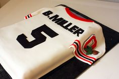 a cake that is shaped to look like a basketball jersey with the number 13 on it