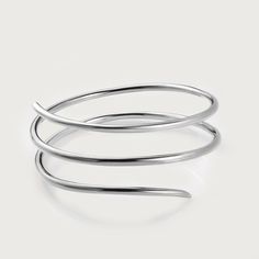 Molto's bestselling collection features a multi-spiral bangle that wraps around the wrist, highlighting your best feature. Light in weight, it can be paired with your watches and other bracelets, too. Made in sterling silver Available in size 7, 7.5, 8, and 8.5 inches Modern White Gold Spiral Jewelry, Modern Spiral White Gold Jewelry, Modern Twist Polished Bangle Bracelet, Elegant Silver Spiral Bangle, Modern Twist Spiral White Gold Jewelry, Modern Twist White Gold Spiral Jewelry, Elegant Spiral Sterling Silver Bracelets, Elegant Silver Spiral Cuff Bracelet, Modern Twist Sterling Silver Bangle Bracelet