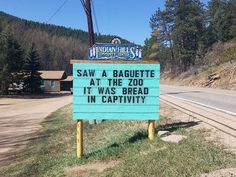 a sign that says saw a baguette at the zoo it was bread in captivity