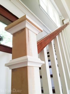 a close up of a wooden stair railing