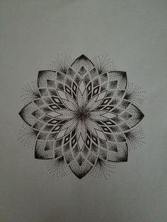 a black and white drawing of a flower on a piece of paper with dots in the middle