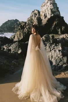 A-line beaded tulle wedding dress with cape sleeves photo 1 Flowing Silk Dress, Wedding Dress Shoulder Cape, Wedding Dress Cape Sleeves, Ethereal Wedding Dress Goddesses, Wedding Dress With Cape Sleeves, Wedding Gown With Cape, Wedding Dress With Cape, Layered Wedding Dresses, Dress With Cape Sleeves