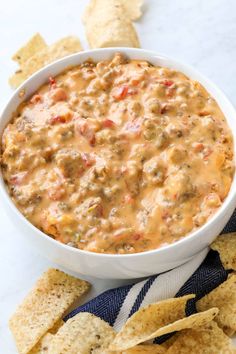 a white bowl filled with salsa and tortilla chips