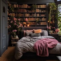 a bedroom with bookshelves and flowers on the wall, bed in foreground