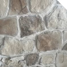 an image of a stone wall that looks like it has been made out of cement