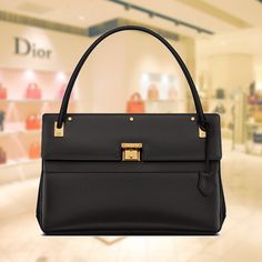 A must-have from the Maison, the Dior Parisienne bag combines an elegant and charming retro design with a refined flair. The model is crafted from luxurious, supple calfskin with a shimmering look. The front slip pocket holds all your everyday essentials, while the accordion pocket with Christian Dior closure in the style of earlier Dior designs can store all your other belongings. The color-coordinated calf suede interior features a zippered pocket. Wear this elegant and versatile Dior Parisien Wallet Chains, Handbag Wallet, Wallet Accessories, Vuitton Bag, Timeless Handbag, Casual Backpack, Retro Design, Bago, Dior Bag