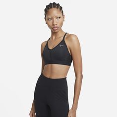 The Nike Dri-FIT Indy Sports Bra makes simple support even easier with straps that adjust in the front. Soft fabric is designed for breathability on the front and back in case you work up a sweat. With easily removable pads and bonded flat seams, it's effortlessly comfortable. This product is made with at least 50% recycled polyester fibers. Easy Adjustment Mini Nike logos on the front of the straps let you make quick adjustments without having to bend over backwards to get the right fit. Breath Nike Images, Sport Nike, Nike Outlet, Top Nike, Strappy Sports Bras, Best Gym, Nike Sports Bra, Nike Sports, Hot Yoga