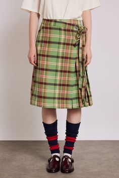 Our Kat Kilt leans into tradition with its green check and side fastening, while its tie details and back pockets nod to modernity. •Wrap skirt detail •Internal jigger button •Tie sides •Back pockets •Knee length •100% organic cotton •Designed in London MODEL INFO: Model is 5'10 and is wearing a UK 10. Damson Madder, London Models, Kilt Skirt, Wardrobe Outfits, Pink Gingham, 가을 패션, School Spirit, Kilt, Yellow And Brown