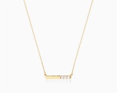 14K Yellow Gold Bar Diamond Necklace. This minimal gold and diamond bar necklace is the perfect gift for those looking for an elegant, modern look. The polished gold is offset with three dazzling diamonds delivering the perfect amount of sparkle on an 18 inch chain. aka Diamond Necklaces Minimalist Diamond Bar Necklace With Single Cut Diamonds, Minimalist Yellow Gold Bar Necklace With Diamond Accents, Minimalist Bar Necklace With Single Cut Diamonds, Gold Minimalist Diamond Bar Necklace, Minimalist Diamond Accents Bar Necklace As Gift, Minimalist Gold Diamond Bar Necklace, Minimalist Diamond Accents Bar Necklace Gift, Minimalist Bar Necklace With Diamond Accents For Gift, Minimalist Bar Necklace With Diamond Accents