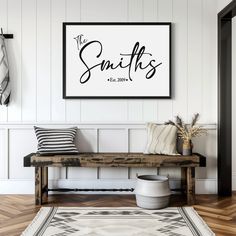 there is a bench in front of a wall with a sign that says smiths on it